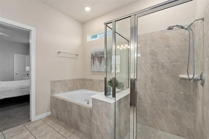 bathroom 1 attached to bedroom 1 and door to pool area