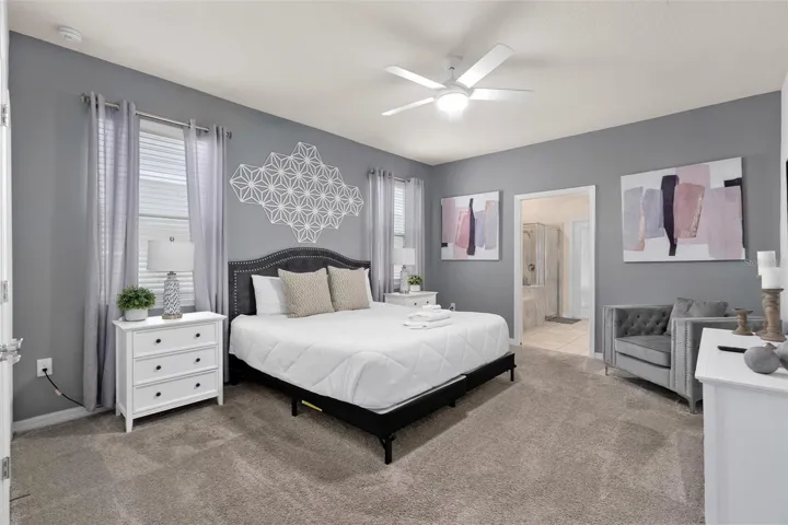 bedroom 1 downstairs with ensuite bathroom that leads out to pool