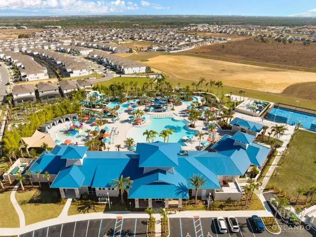 6,500-square-foot clubhouse with an expansive water park with a zero-entry pool, lazy river, double water slides, splash pad, sports courts, and on-site dining