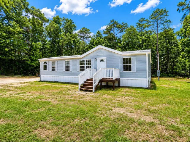 "Private Country Retreat on Nearly an Acre with Metal Roof, Storage Shed &amp; Garden Area"