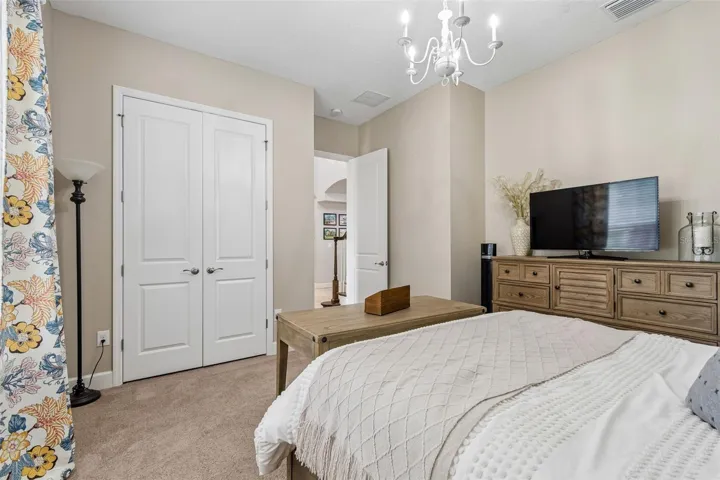 Bedroom 2 with en-suite bathroom looking out to the foyer