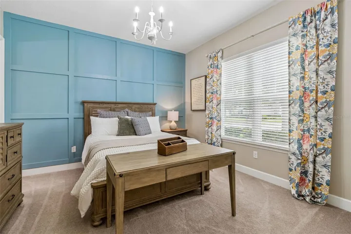 Bedroom 2 with en-suite bathroom and custom accent wall (1st floor)