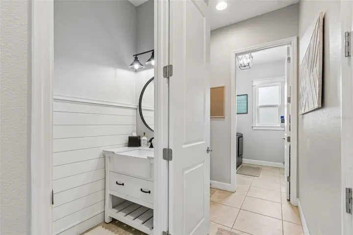 Hall 1/2 Bath with Laundry room in the distance