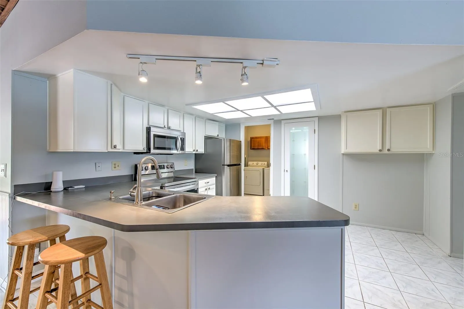 Kitchen open to living room and dining room