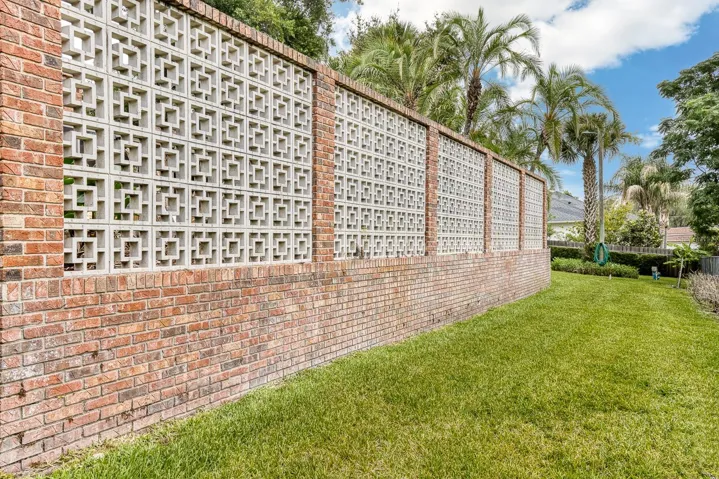 Breeze Block Wall from the pool area down to the rear yard