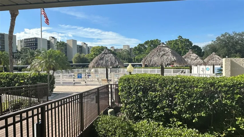 Tiki Hut Gathering Area next to Swimming Pool and Clubhouse Porch.