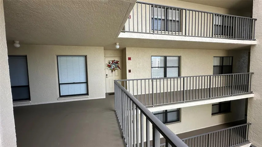 Fourth Floor unit 4E Front Door, Large Kitchen and Bedroom 2 Windows. Elevator and trash Towers to the right