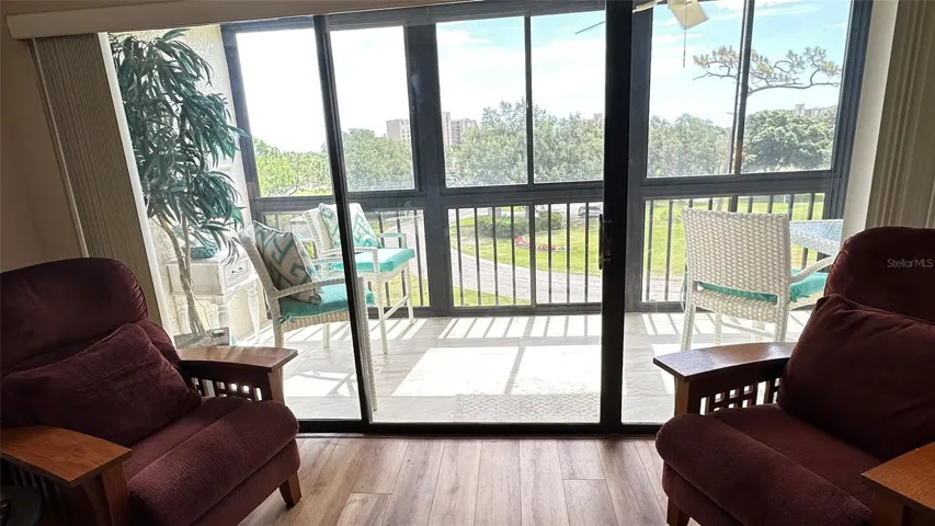 Living Room Triple Sliding Door to Porch. Sitting Area