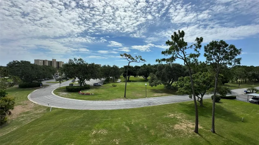 Center View from 4E Fourth Floor Porch. Tee Box, Fairway and Clubhouse/Restaurant