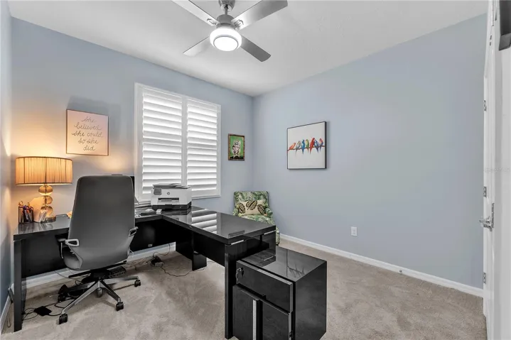 Bedroom # 2 has a built-in closet, ceiling fan, carpet and plantation shutters.