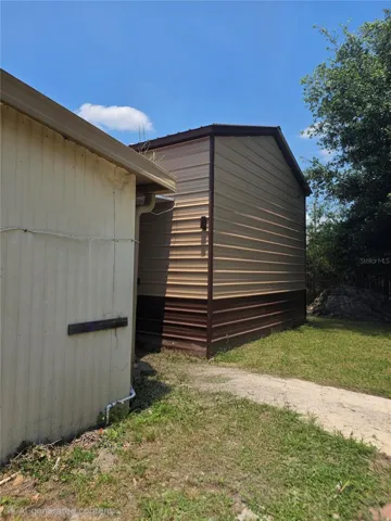 Back exterior of storage shed with 2nd story