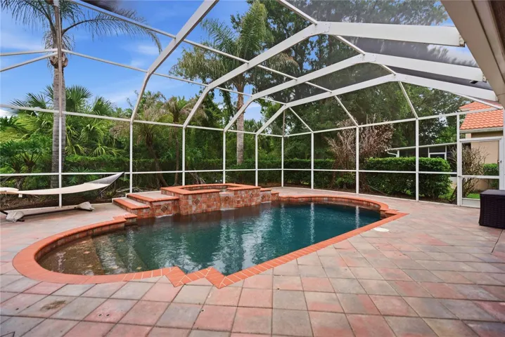 Covered screened lanai with heated pool and spa