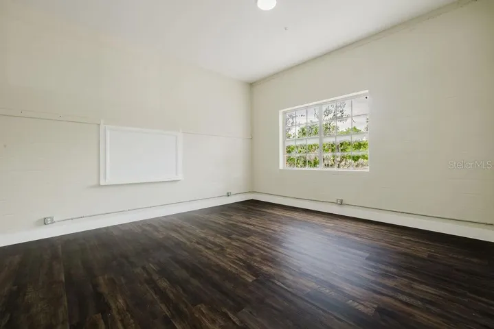 Living room with original historic chalkboard.