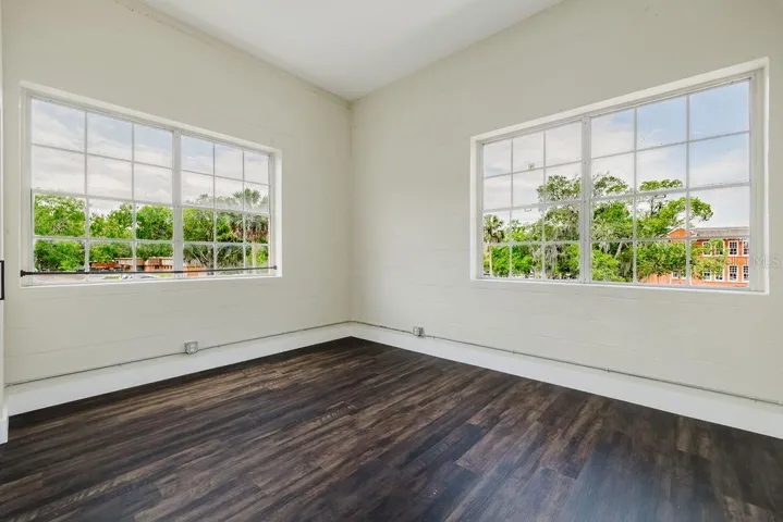 Bedroom with light and bright windows.