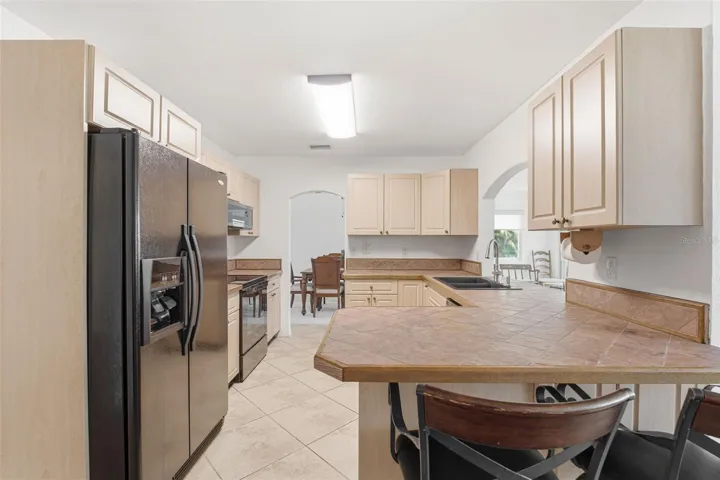Kitchen with Breakfast Bar and Water Views