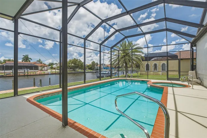 Grand Elevated Pool Cage with Resurfaced Pool & Spa