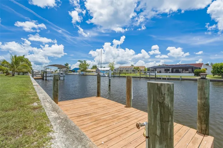 Private Doc with Expansive Canal Views & Sailboat Access.