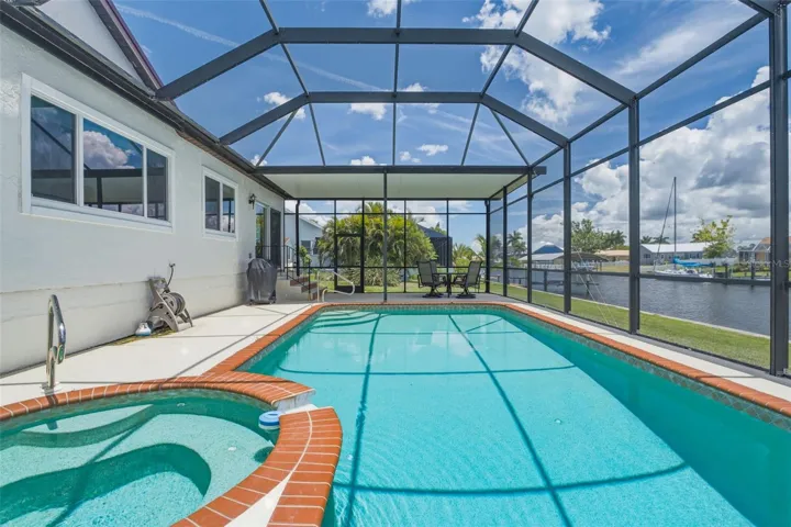 Screened Waterfront Pool & Spa with Canal Views.