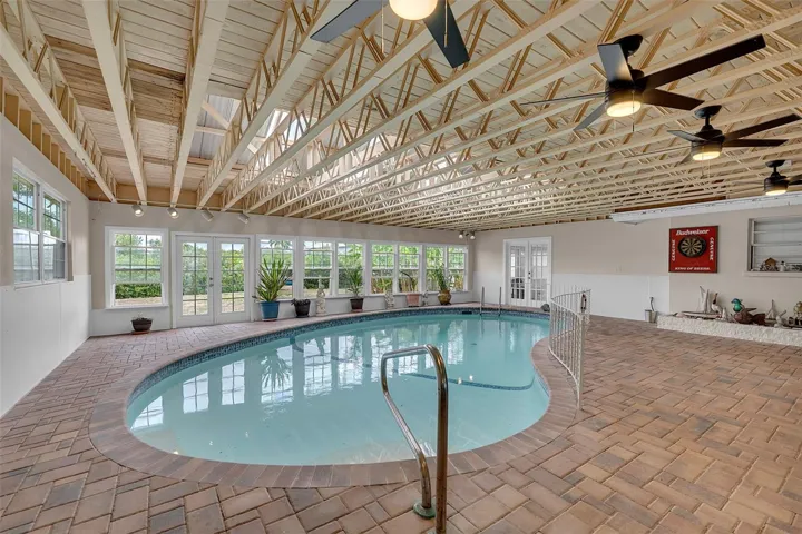 Rain or Shine enjoy a swim or entertain guest after a day on the boat poolside. Surrounded by pavers and tons of windows.