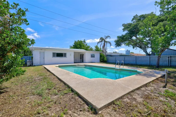 Large backyard space with large pool for your enjoyment