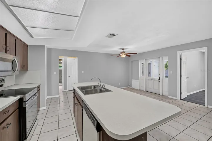 Large Kitchen family room combo  central to the surrounding 3 bedrooms.