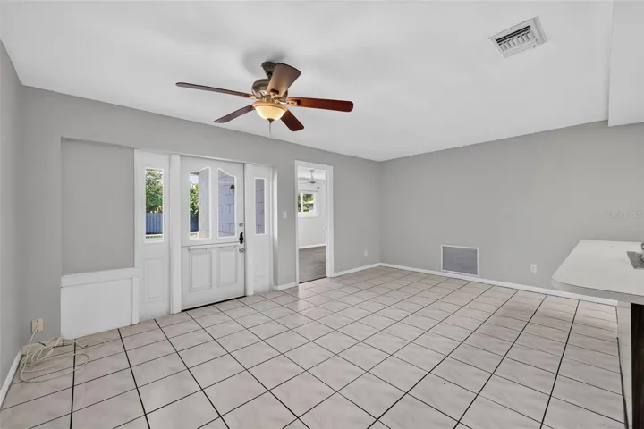 Back door access to the pool off the Kitchen-family room .