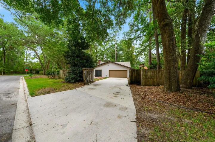 Corner lot with private fenced driveway