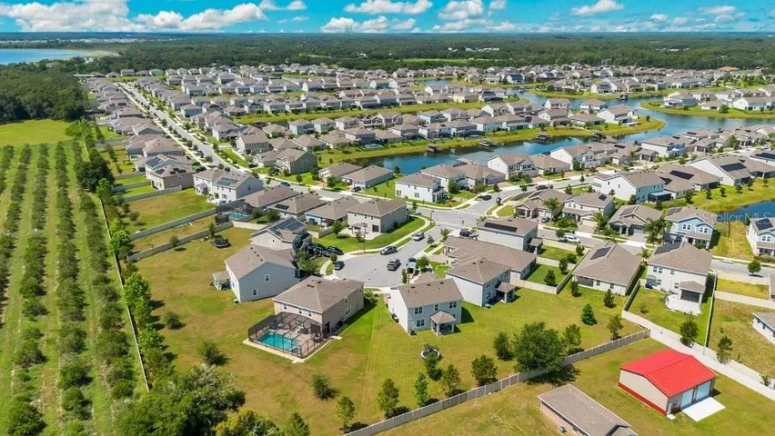 Aerial view of back of the home and community.