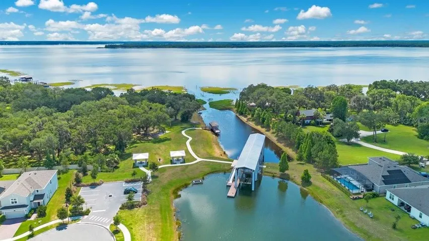 One of the community's most unique features—a PRIVATE BOAT LIFT provides access to the Chain of Lakes, making it easy to enjoy boating, fishing, and waterfront adventures.