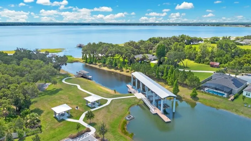 One of the community's most unique features—a PRIVATE BOAT LIFT provides access to the Chain of Lakes, making it easy to enjoy boating, fishing, and waterfront adventures.