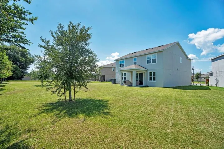 The SPACIOUS BACKYARD offers plenty of room for outdoor entertaining, play, gardening, or even future enhancements.