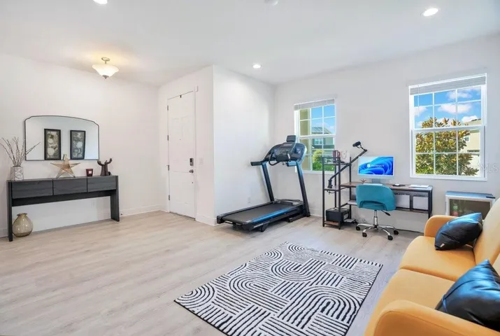 A SEPARATE LIVING ROOM near the front of the home OFFERS FLEXIBILITY for a formal sitting area, home office, playroom, or additional gathering space.
