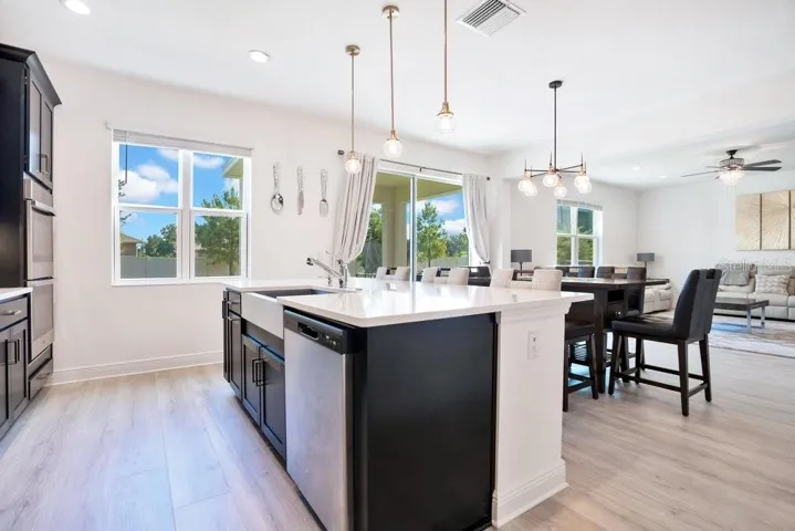 At the heart of the home, the OPEN-CONCEPT Kitchen, Dining area, and Family Room create an inviting atmosphere filled with plenty of natural light.