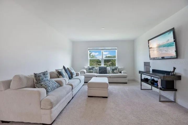 Upstairs, a GENEROUS LOFT offers endless possibilities as a media room, game room, home office, fitness area, or second living space.