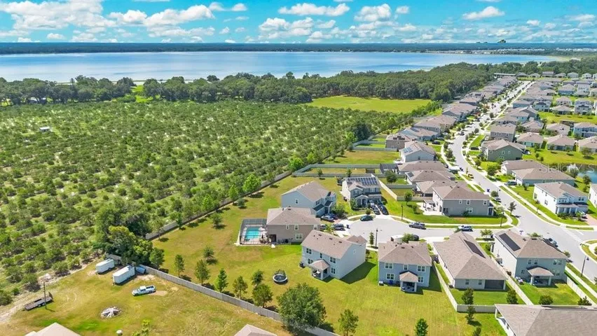 Aerial view of back of the home and community.