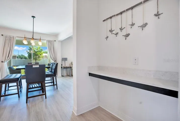 Inside, find beautiful WOOD-LOOK TILE FLOORING throughout the main living areas and a layout designed for both comfortable everyday living and effortless entertaining.