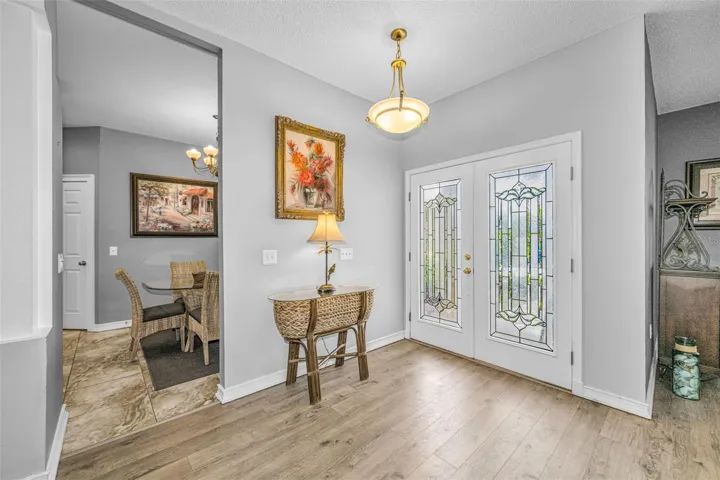 Artful Foyer with arches and art niches