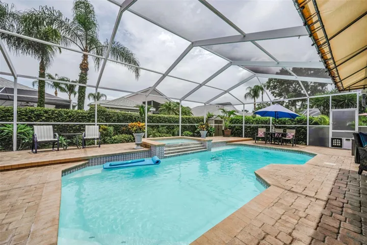 Heated Screen exclosed pool with overflow spa