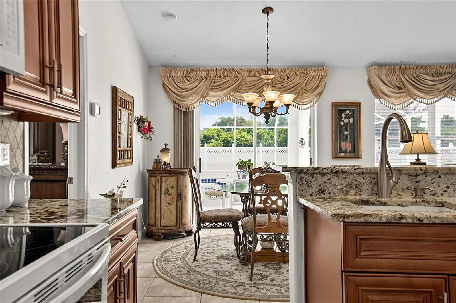 Kitchen with view of dinette and pool lanai