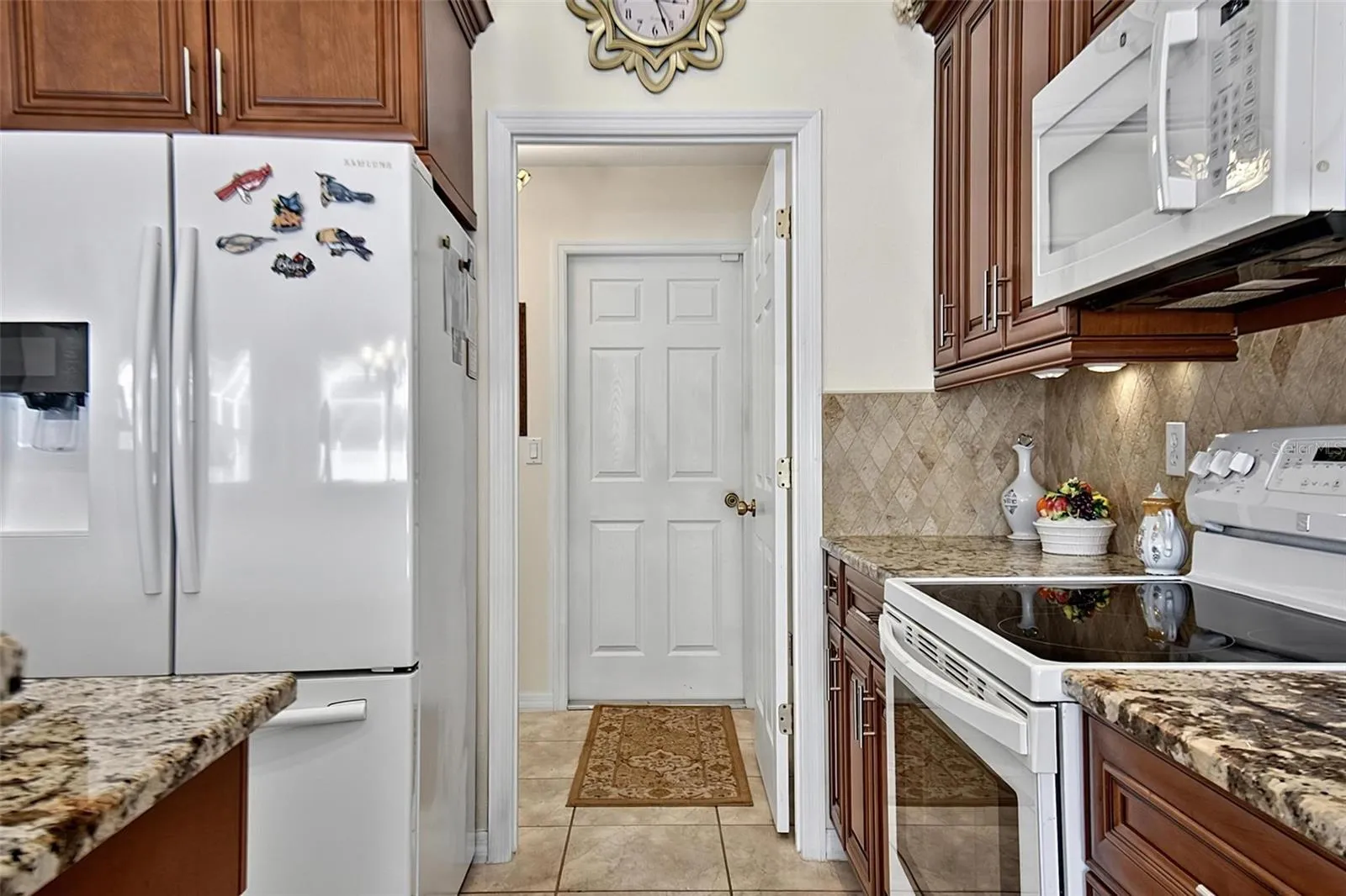 Kitchen with view into laundry room