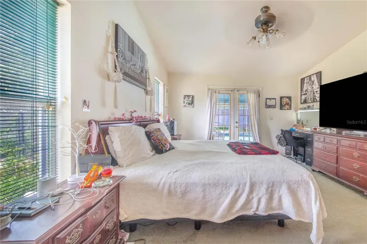 Master Bedroom W/ French Doors leading to Pool area
