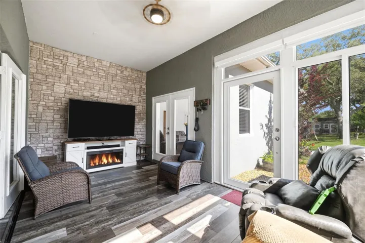 sunroom with electric fireplace