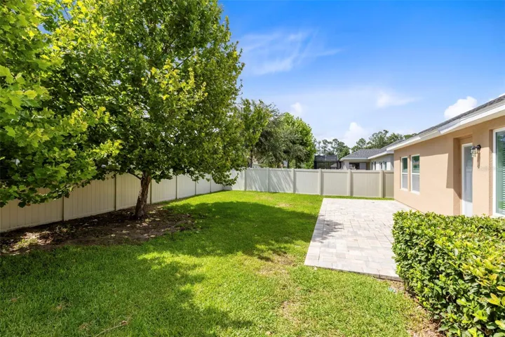 Subject backyard- shade trees for added outdoor enjoyment