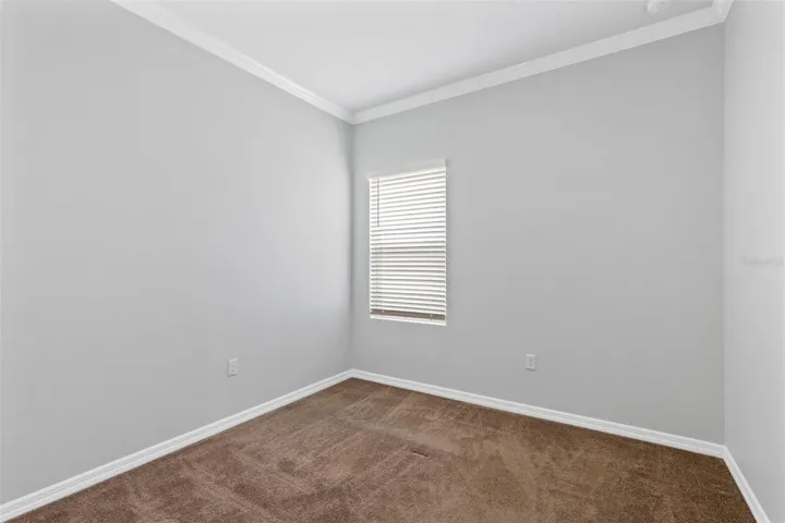 Bedroom 4 offers crown molding