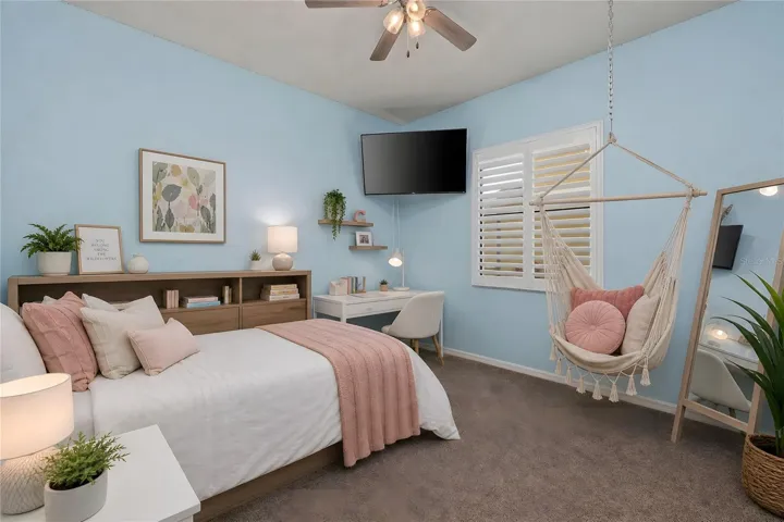 Bedroom 2 with ceiling fan and plantation shutters