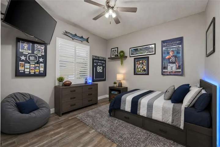 Bedroom 3 with ceiling fan and plantation shutters
