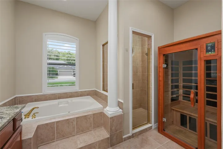 Large tub to soak the stress of your day away, a shower and a sauna