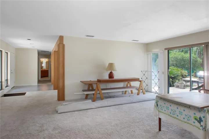 Family room with fire place and pool patio