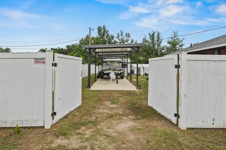 Double gate to boat storage and shed