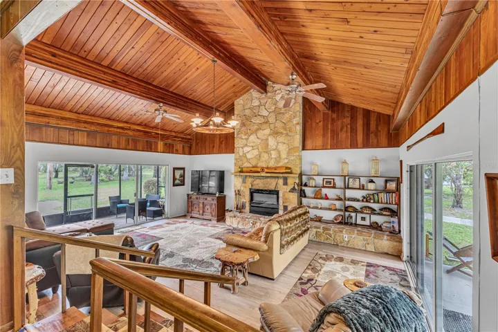 Livingroom with Fireplace Front Screened in porch and open back sitting area